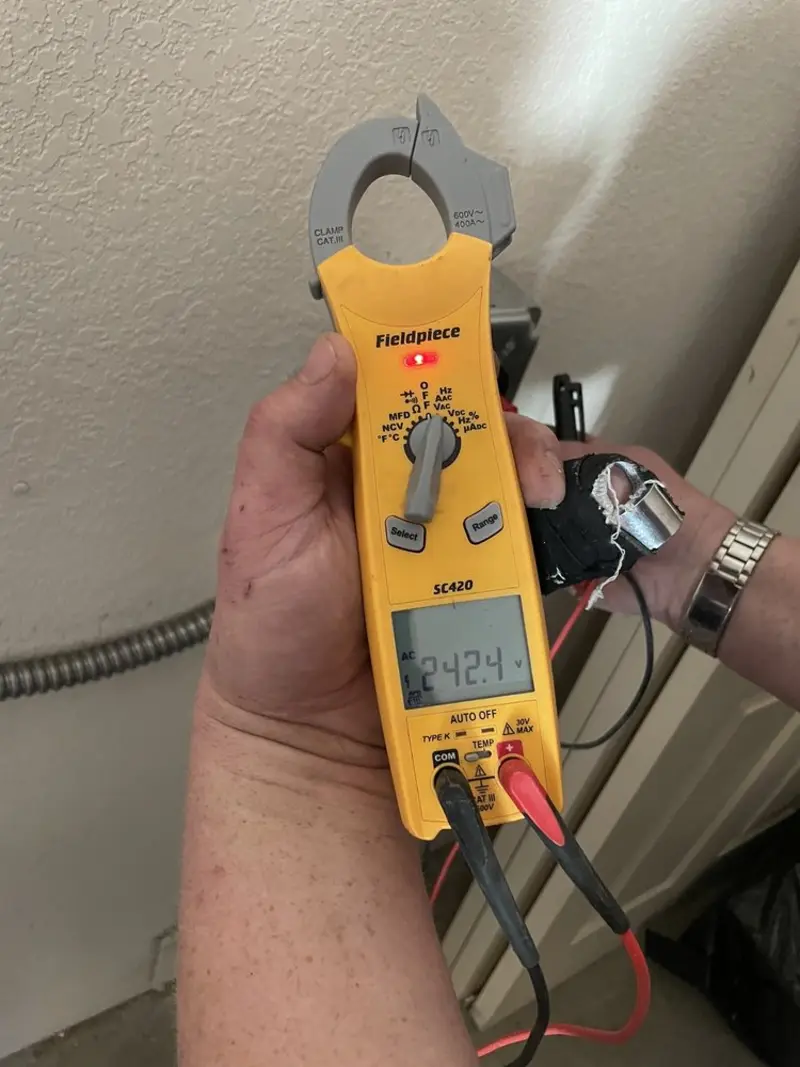 Voltage testing with clamp meter during Ceiling Fan Installation in La Blanca